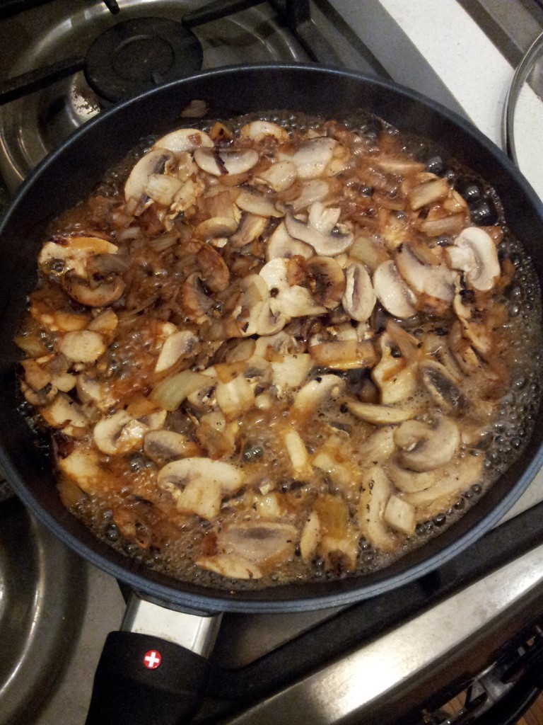 mushrooms frying in pan